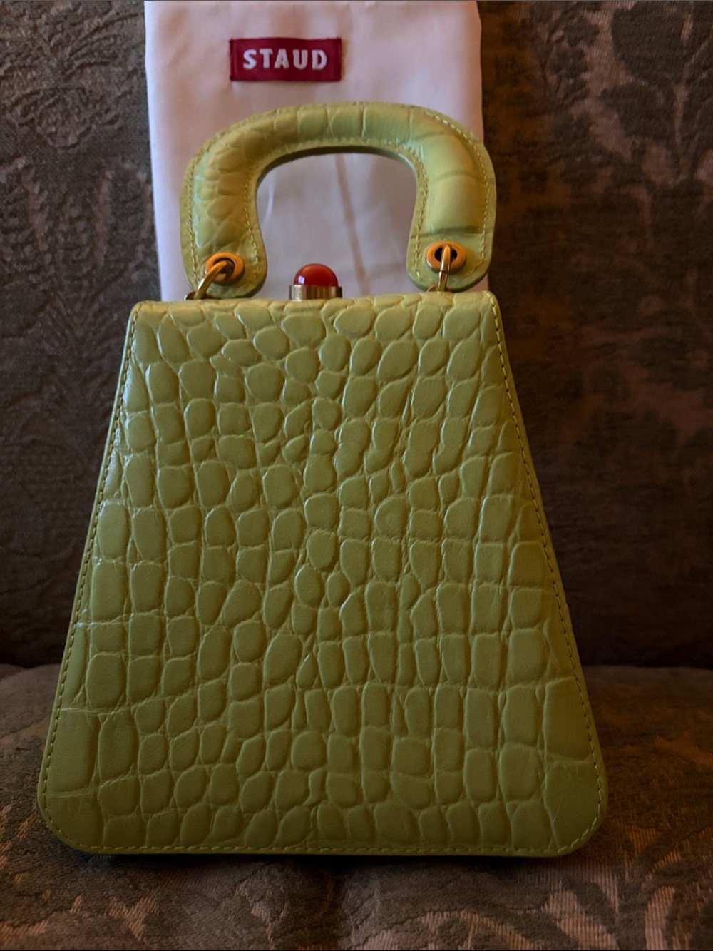 STAUD Lime Green Croc-Embossed Top Handle Mini Bag with Red Accent
Never used